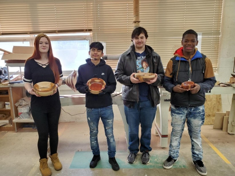 Bowl Turner's Club students posing with their projects